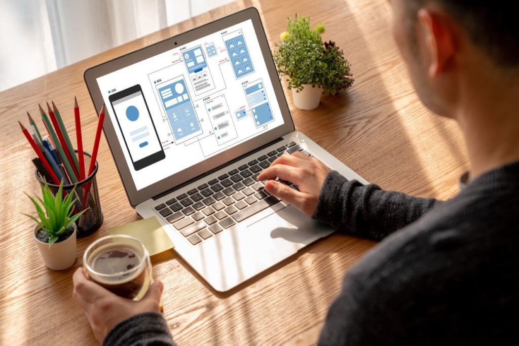 user flow mockup on a laptop