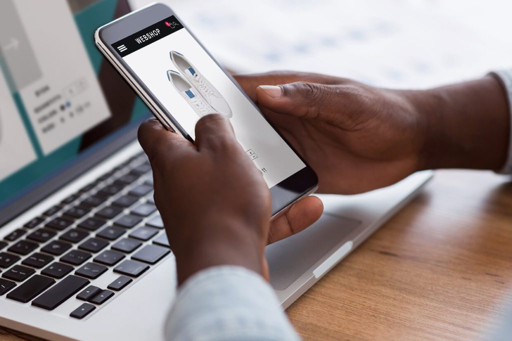 person testing responsive design on a mobile device
