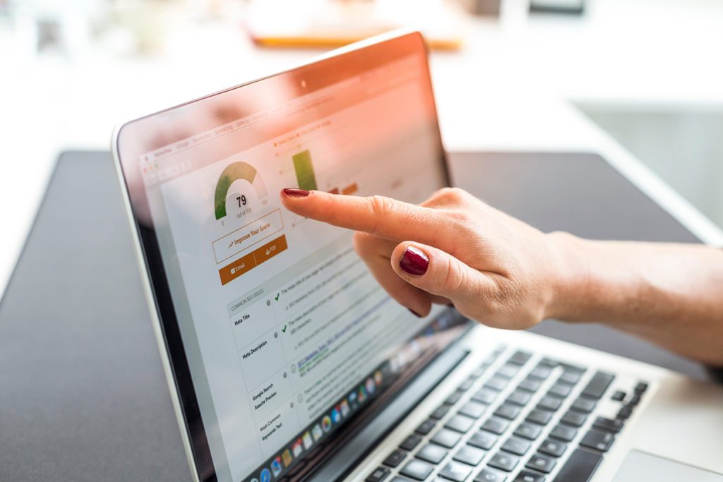 speed chart on a laptop, close-up of screen with hand