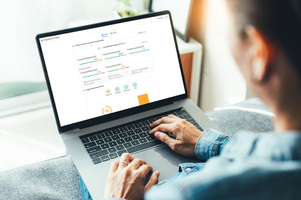 person looking at Core Web Vitals on a laptop