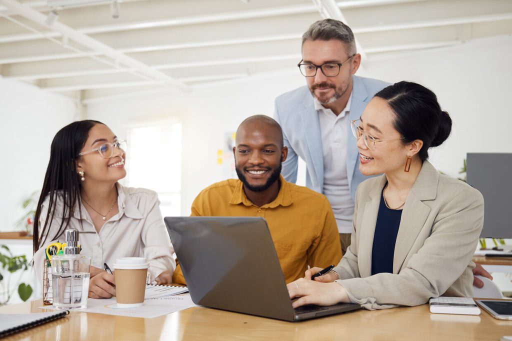 2 men and 2 women gathered around a table